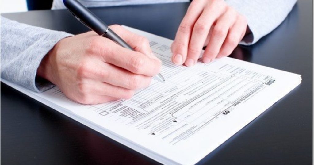 A man filling form